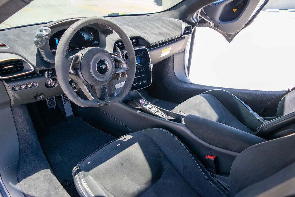 Silver McLaren Artura rental, a 3.0 liter twin-turbo V6 on a carbon tub