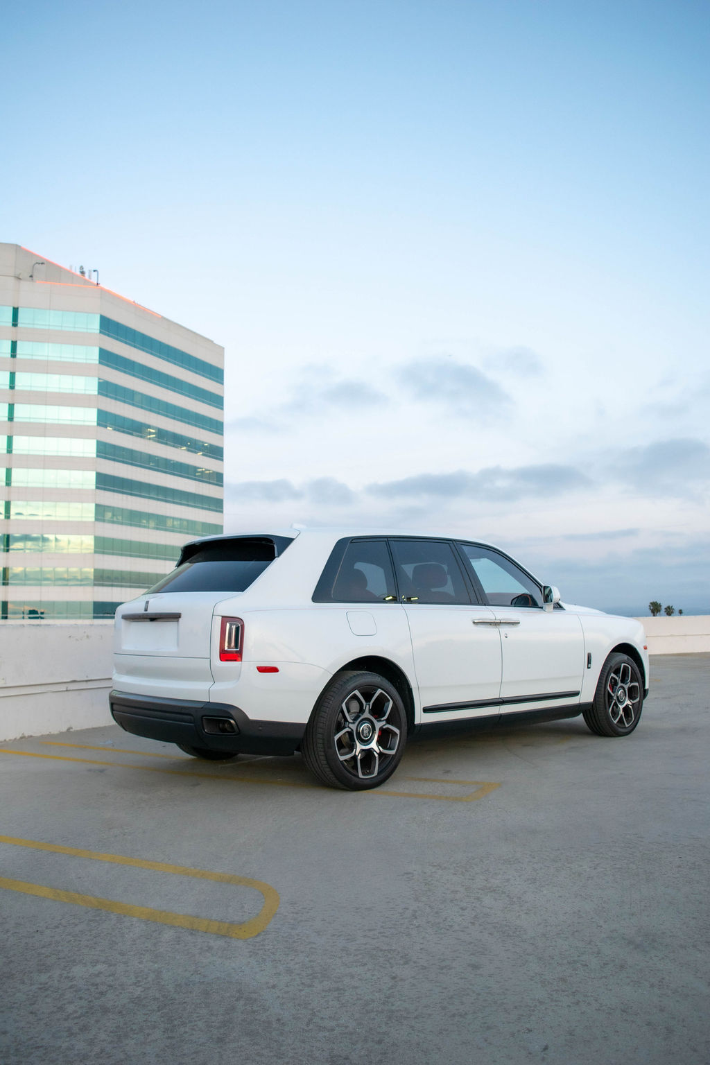 Rolls Royce Cullinan rental, a 592 hp twin-turbo V12 SUV in white