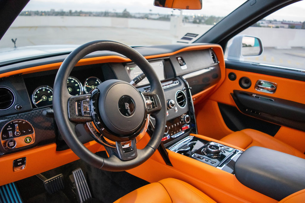 Rolls Royce Cullinan rental in white, with a two piece tailgate and 600 liters of cargo space