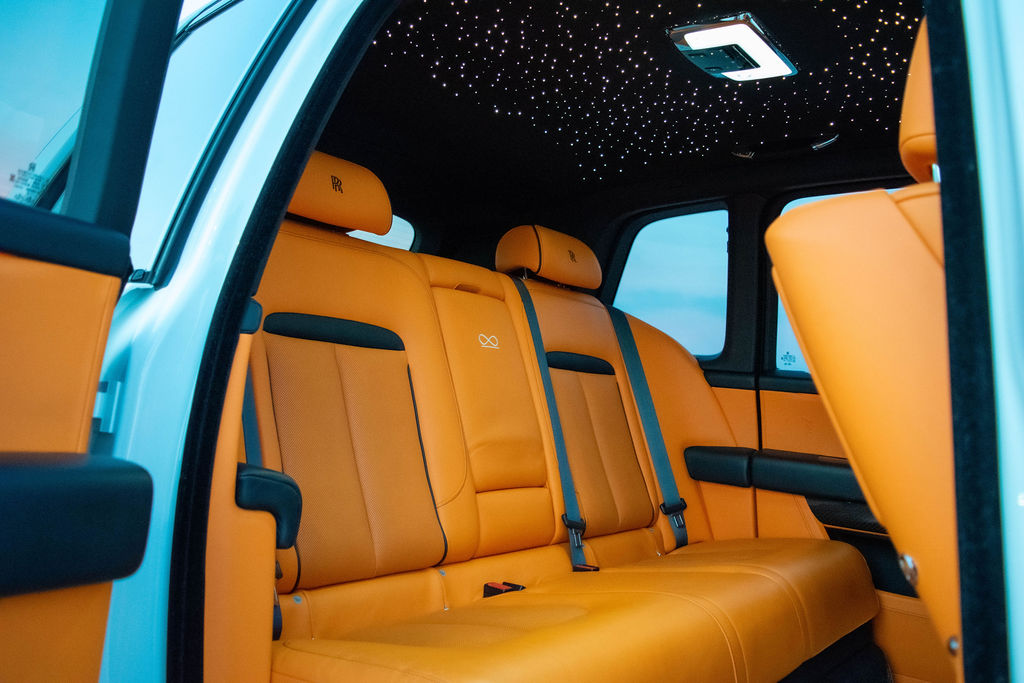 White Rolls Royce Cullinan rental, a 5 seat SUV with all-wheel drive