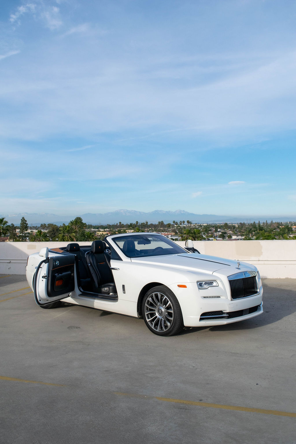 White Rolls Royce Dawn rental in Orange County, Orange and Black interior