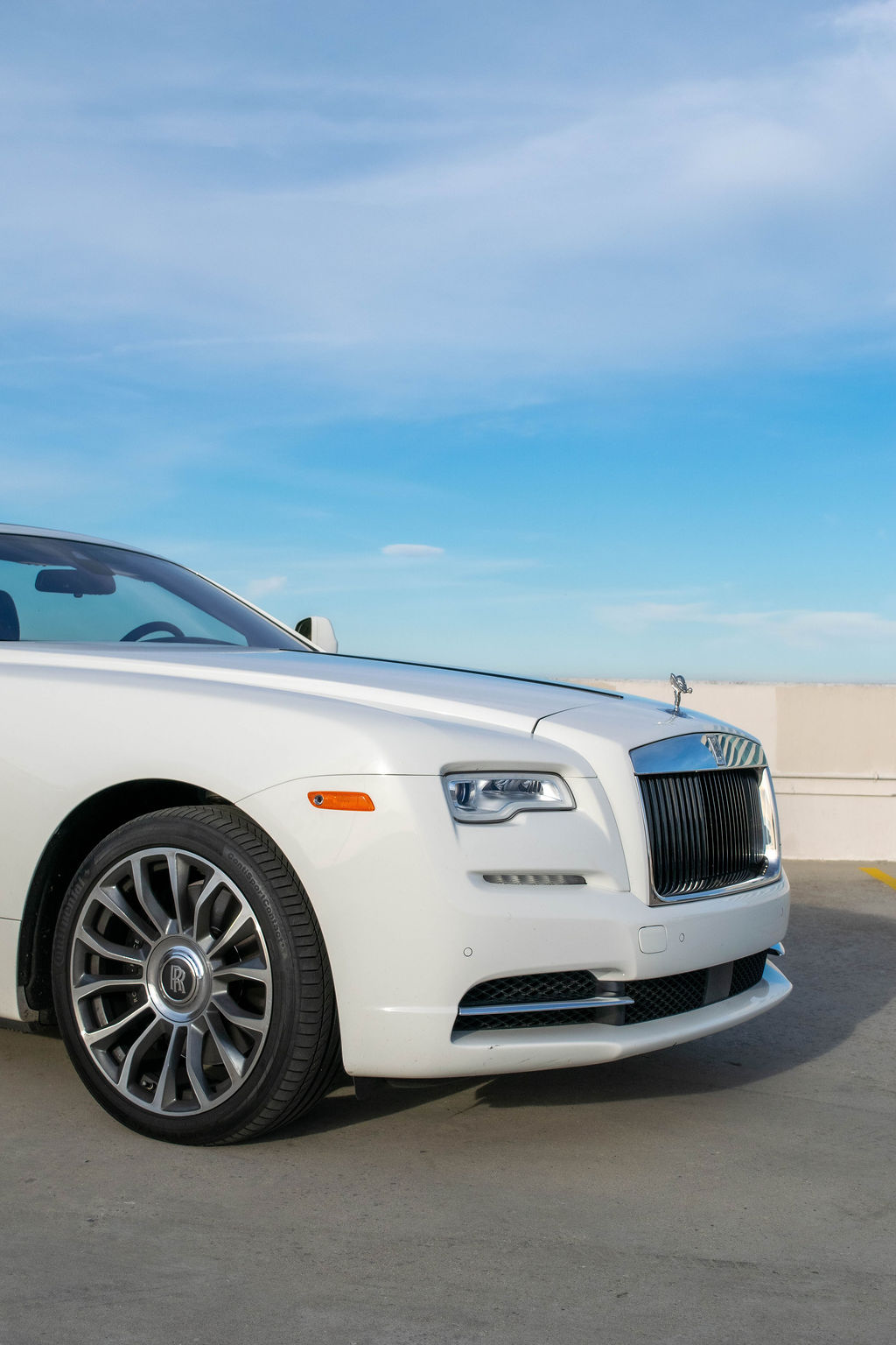 Rolls Royce Dawn rental in white, a 6.6 liter twin-turbo V12
