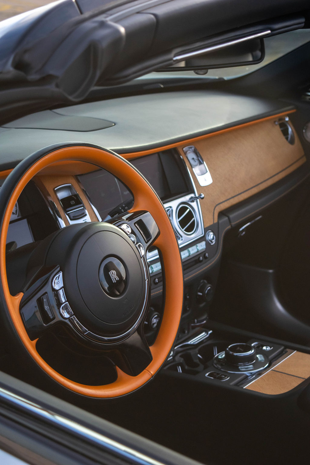 Rolls Royce Dawn rental, a 563 hp twin-turbo V12 convertible in white