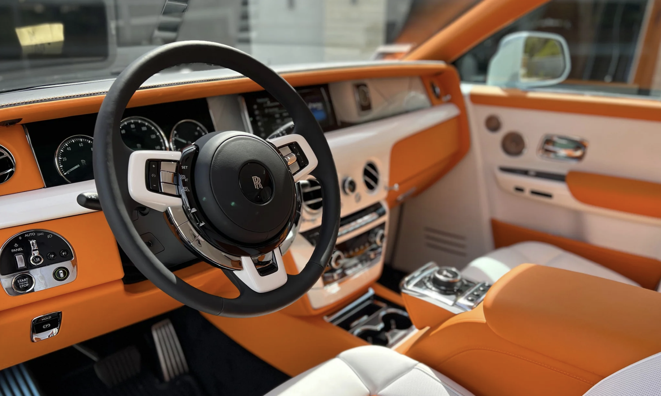 White Rolls Royce Phantom rental, a 5 seat rear-wheel drive sedan