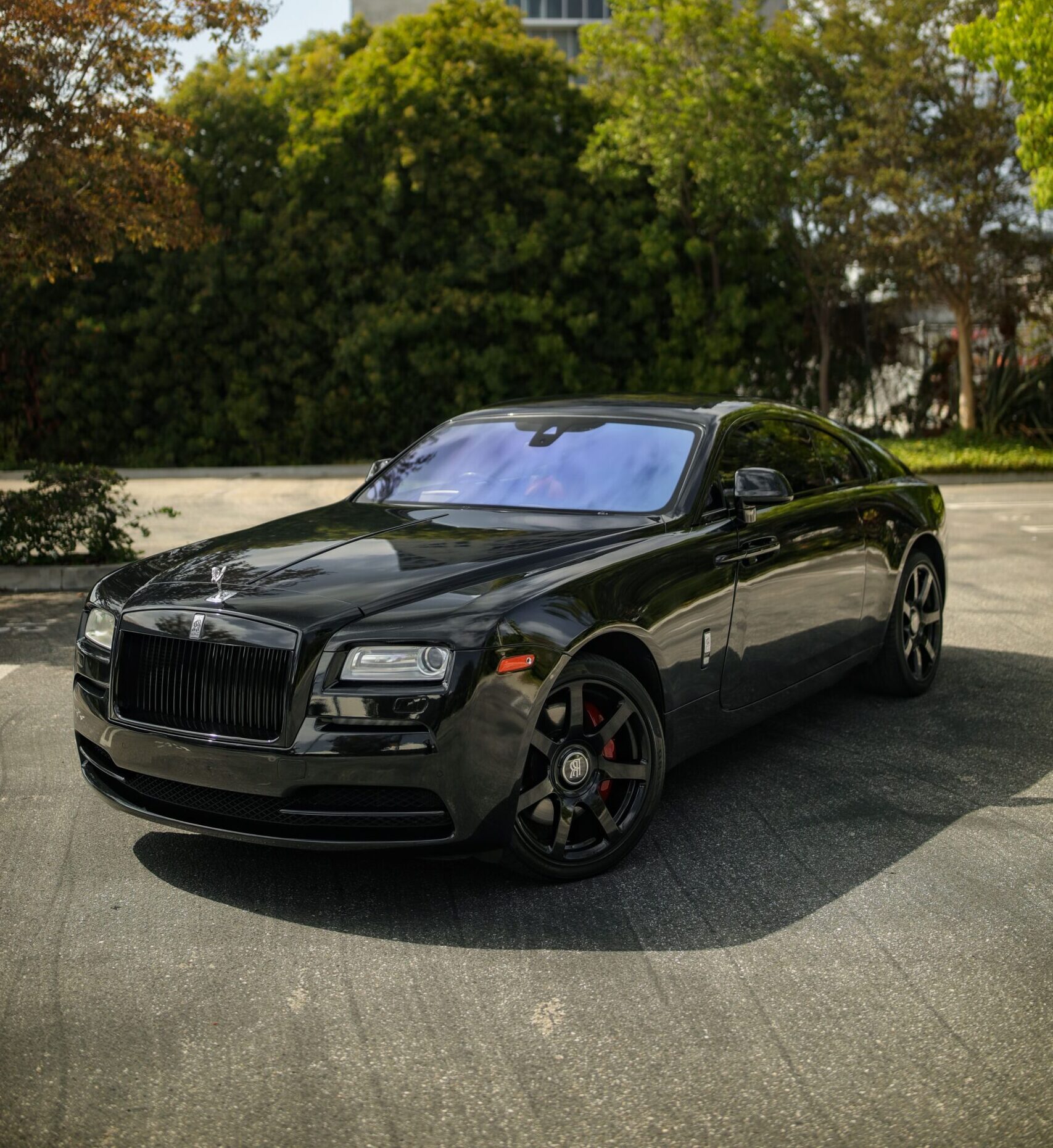 Front view of the black Rolls Royce Wraith rental, a 6.6 liter twin-turbo V12