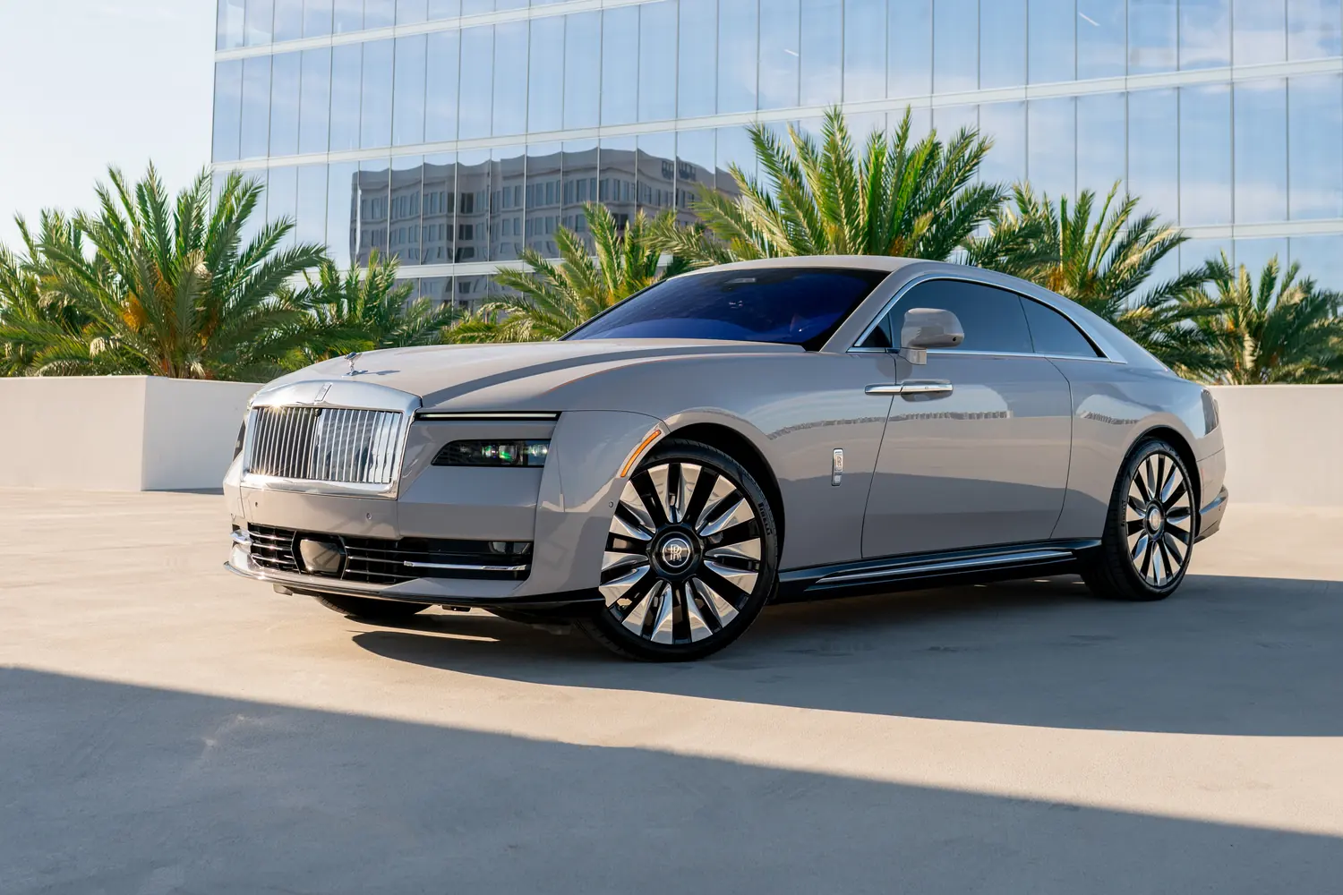 Grey Rolls Royce Spectre rental in Southern California, Orange and Black interior
