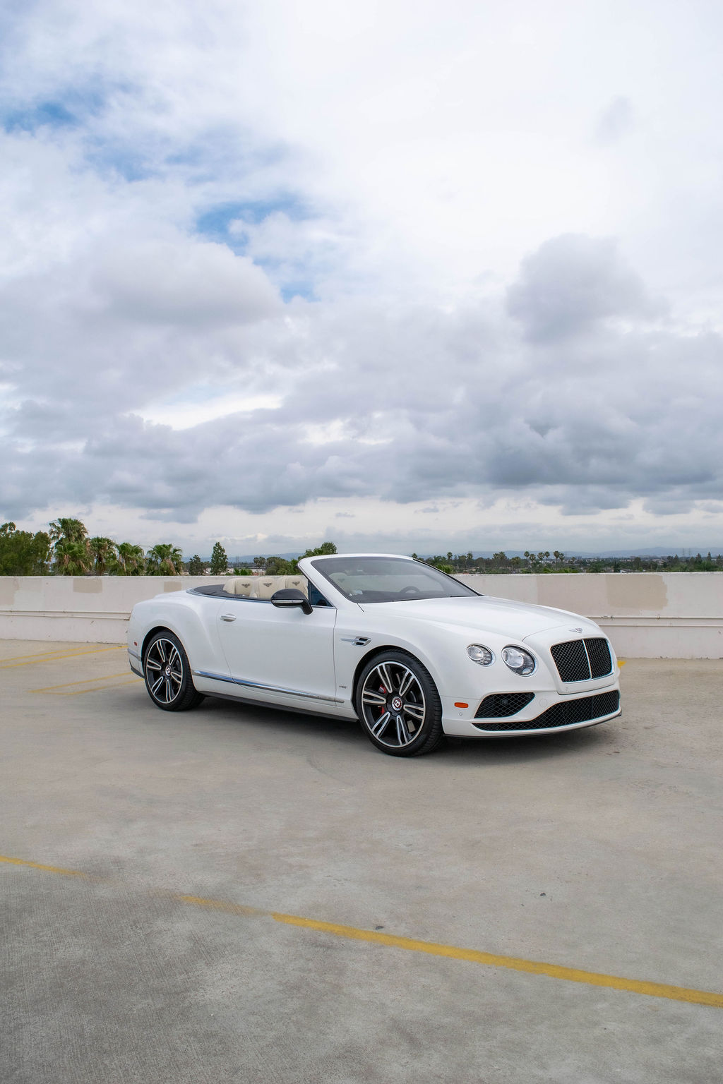 Bentley Continental GTC rental, a white convertible grand tourer seating 4