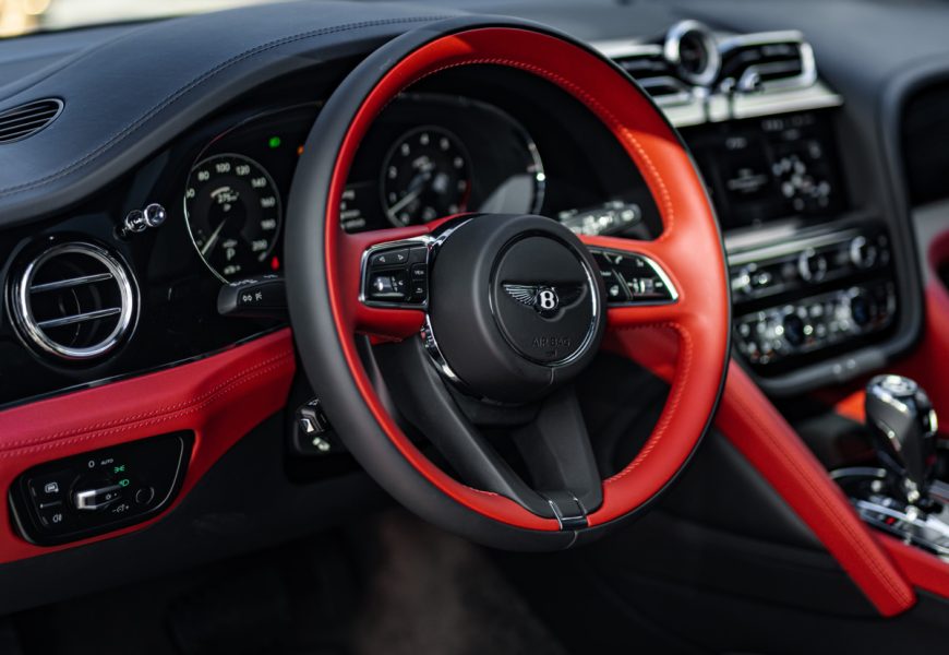 Steering wheel in the Bentley Bentayga S rental, a 542 hp twin-turbo V8 SUV