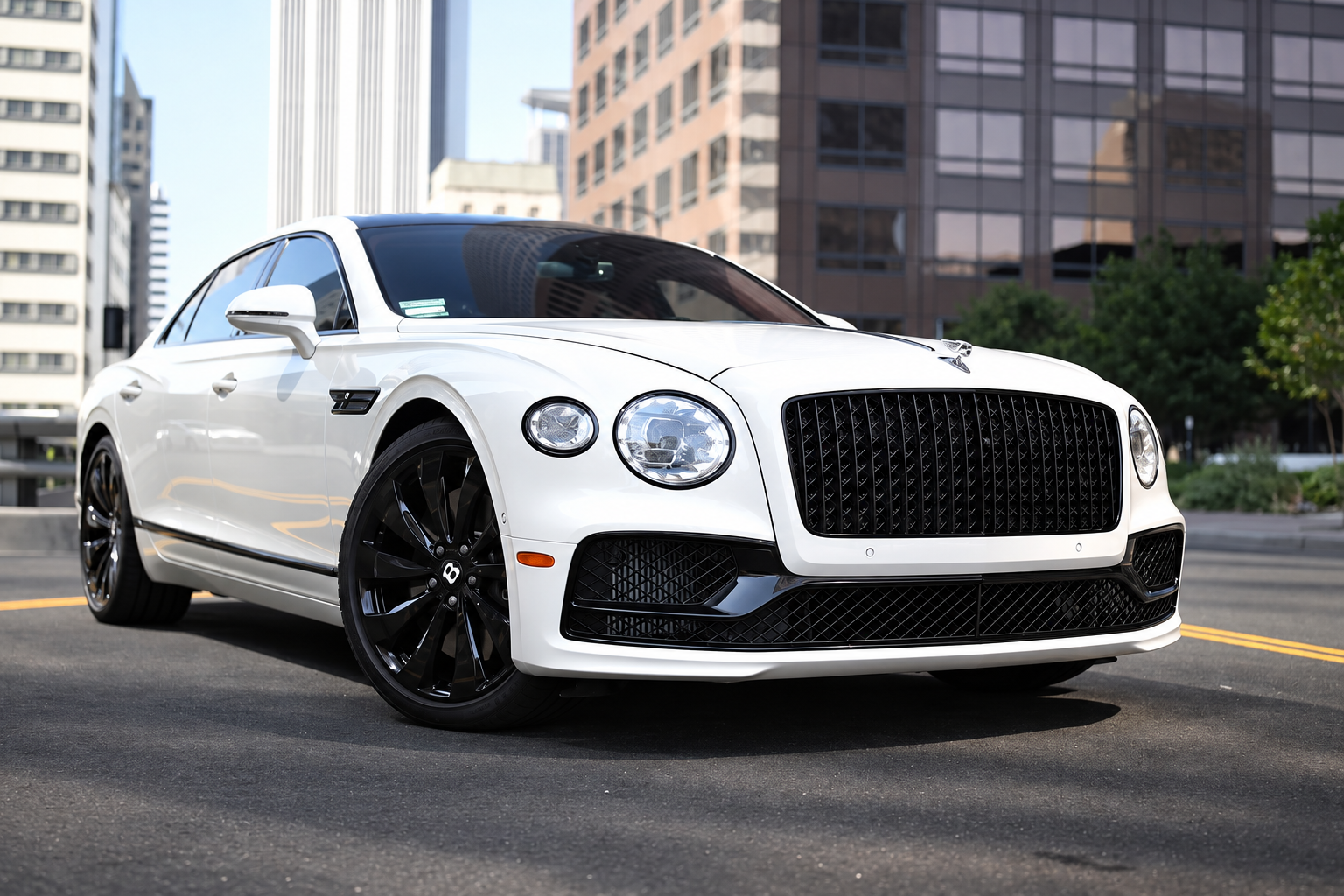 Front view of the white Bentley Flying Spur rental, a 542 hp V8 luxury sedan