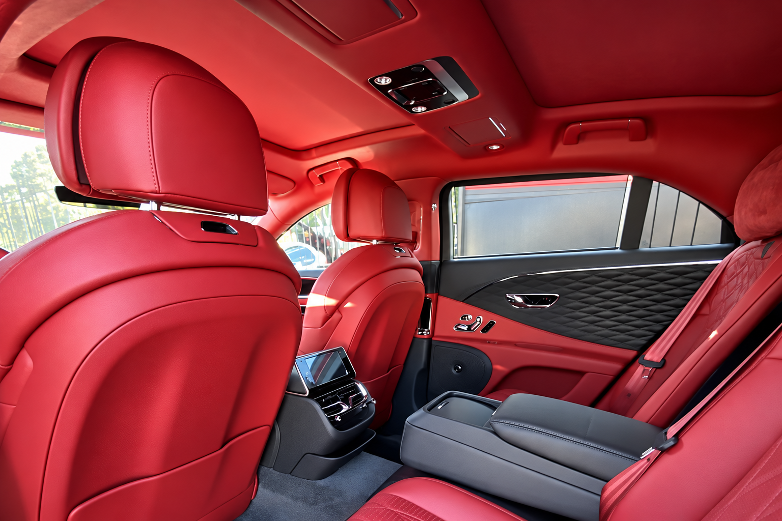 Red rear seats in the Bentley Flying Spur rental, a 5 seat luxury sedan