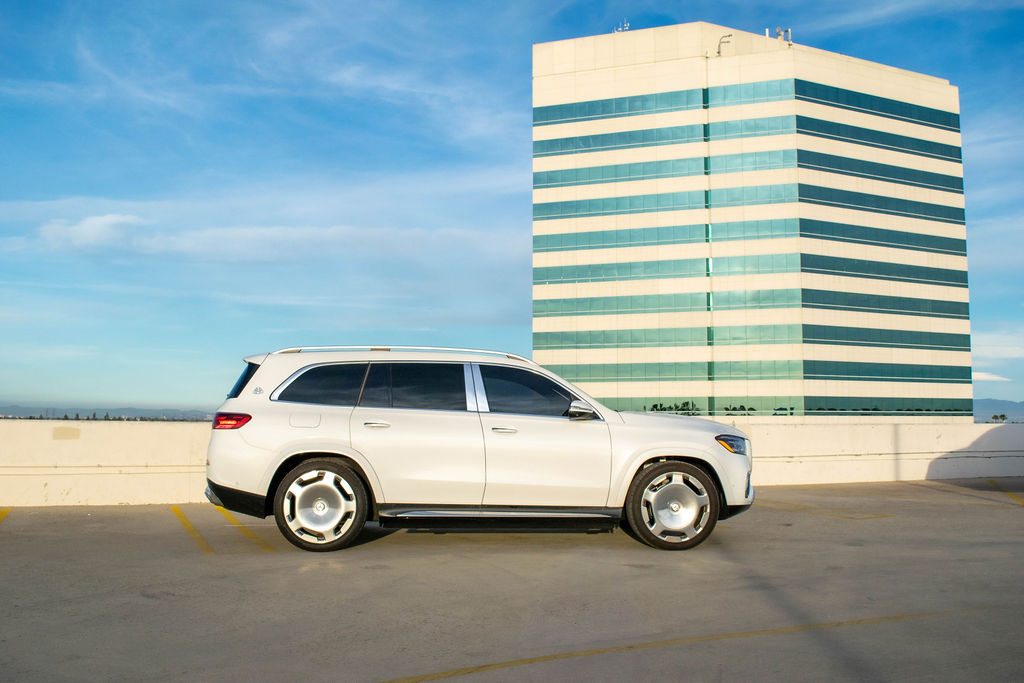 White Maybach GLS 600 rental, a 4 seat SUV with a hidden staircase