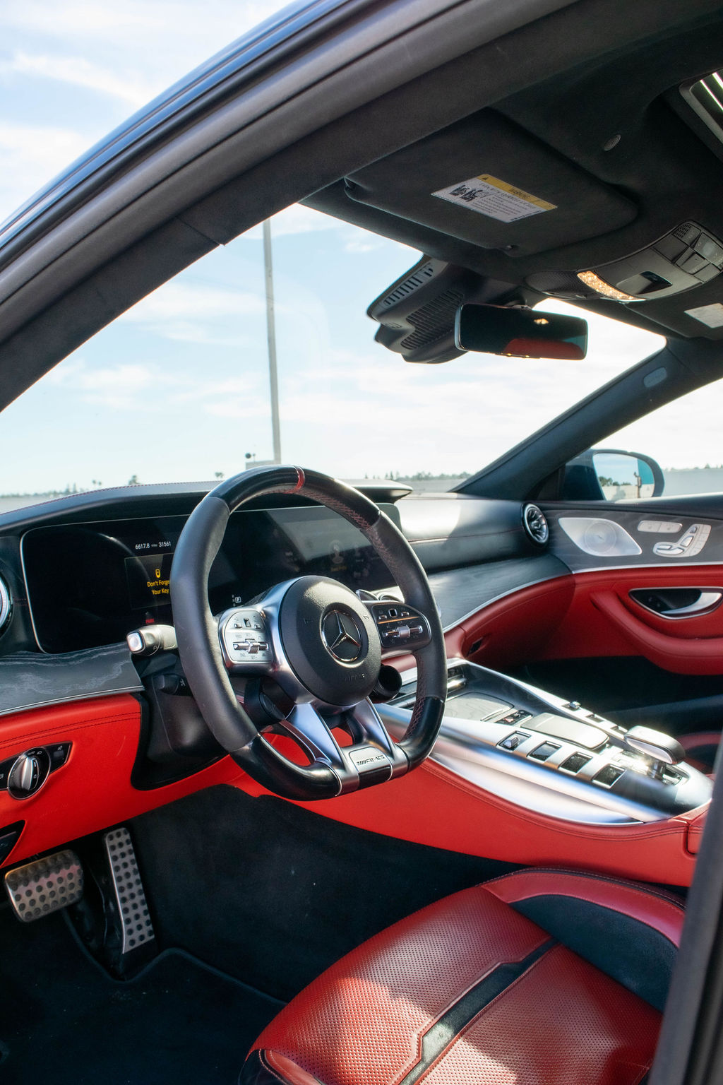 Black Mercedes-AMG GT rental, a 4.0 liter twin-turbo V8 with rear-axle steering