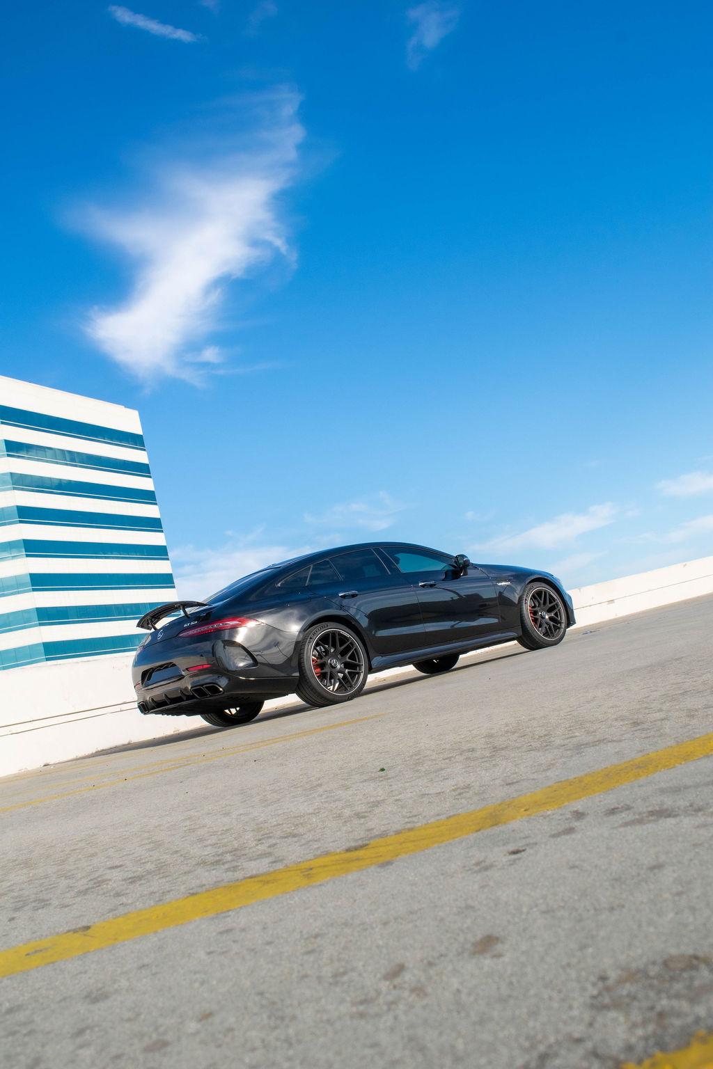 Black Mercedes-AMG GT rental, a 4 door fastback seating 4