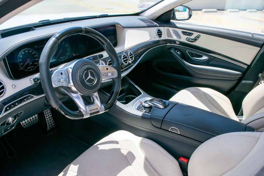 White Mercedes-Benz S-Class rental, a full size sedan seating 5