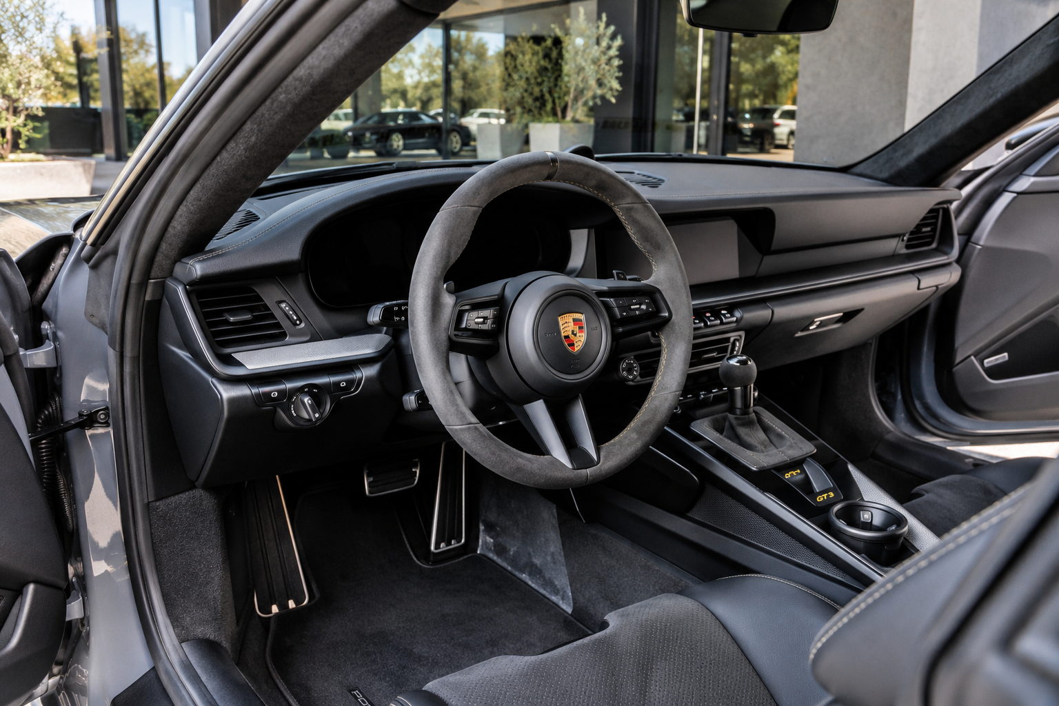 Steering wheel in the Porsche 911 GT3 rental, a 502 hp naturally aspirated flat-six