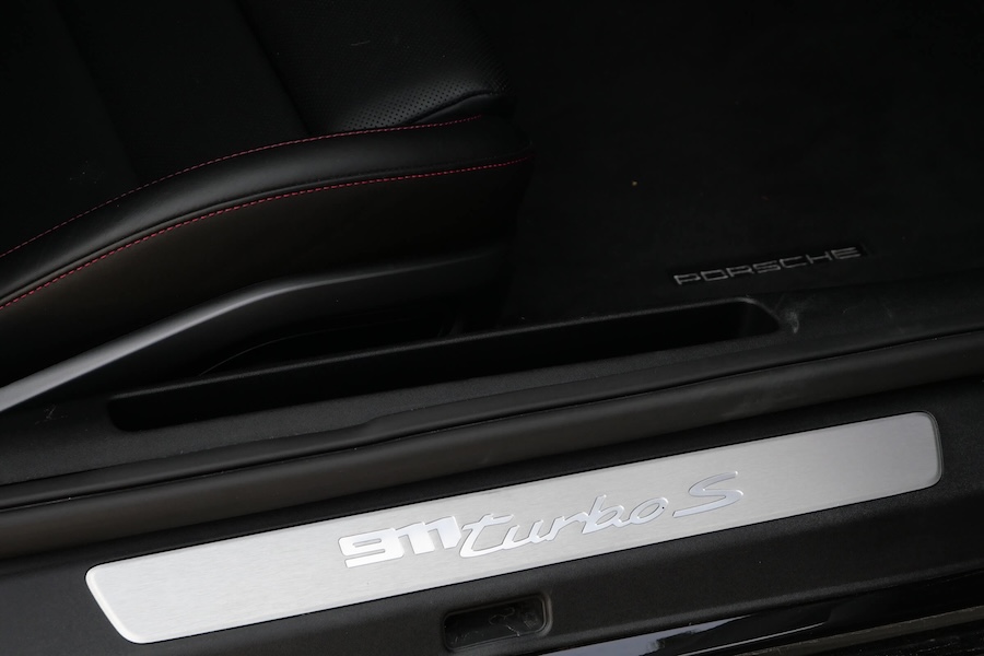 Door sill on the black Porsche 911 Turbo S rental
