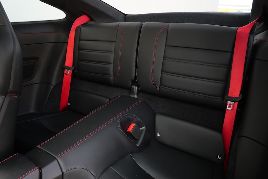 Rear seats in the Porsche 911 Turbo rental, a coupe seating 4