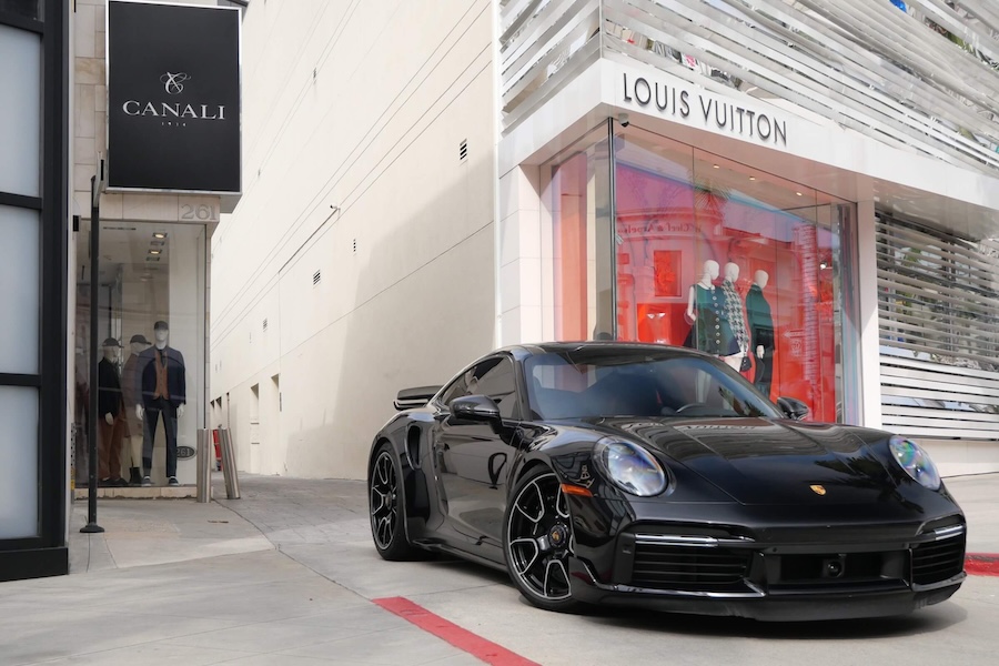 Front view of the Porsche 911 Turbo S rental in black, reaching 60 mph in 2.6 seconds