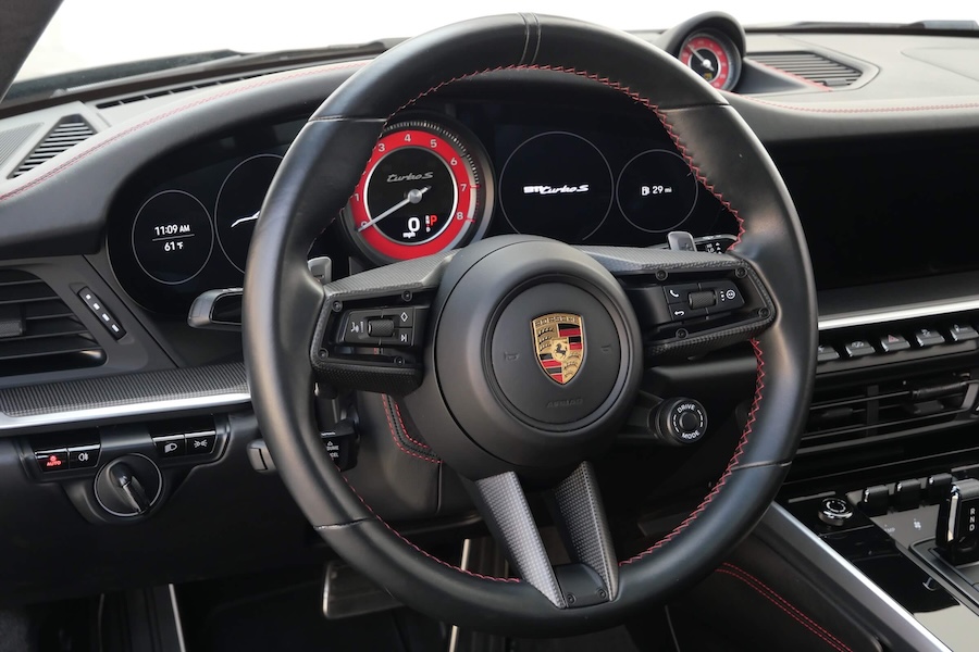 Steering wheel in the Porsche 911 Turbo rental, a 3.7 liter twin-turbo flat-six