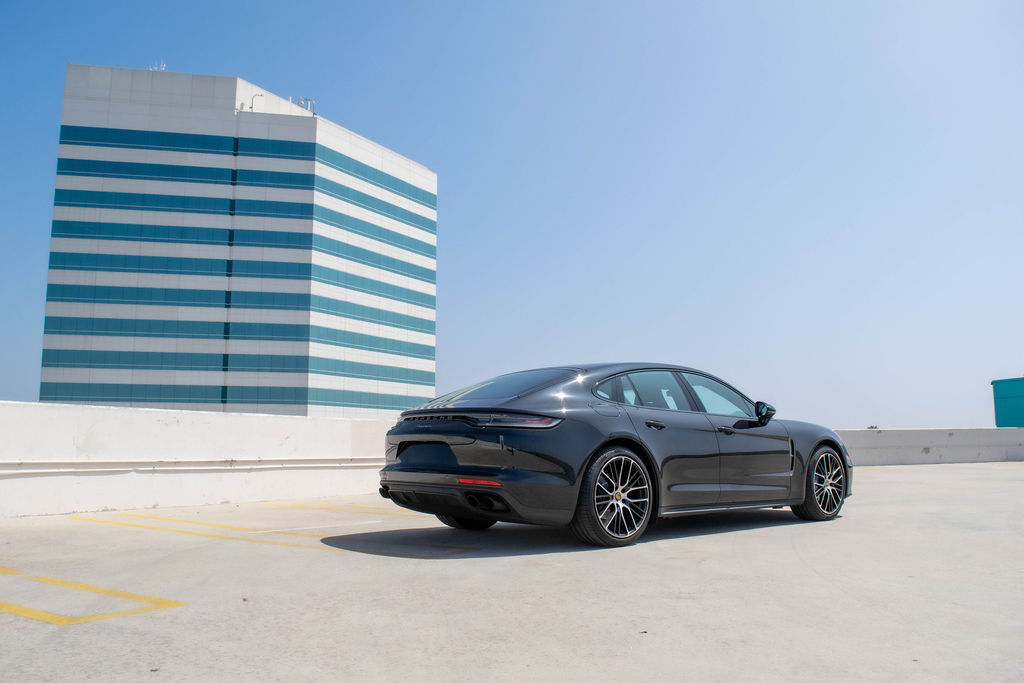Black Porsche Panamera rental, a 4 seat rear-wheel drive sedan
