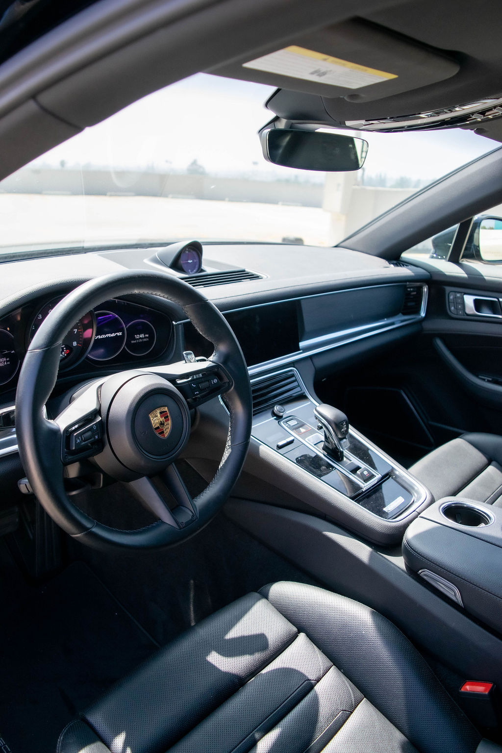 Porsche Panamera rental, a 325 hp twin-turbo V6 sedan in black