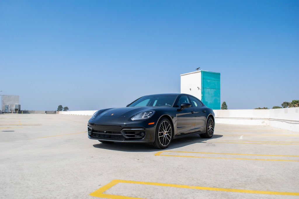 Black Porsche Panamera rental, a sedan with two sculpted individual rear seats