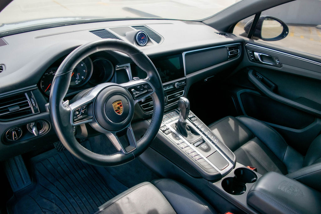 Black Porsche Macan rental, a 5 seat SUV with all-wheel drive