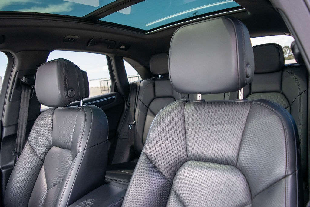 Porsche Macan rental in black, the Porsche built to carry a group and their bags
