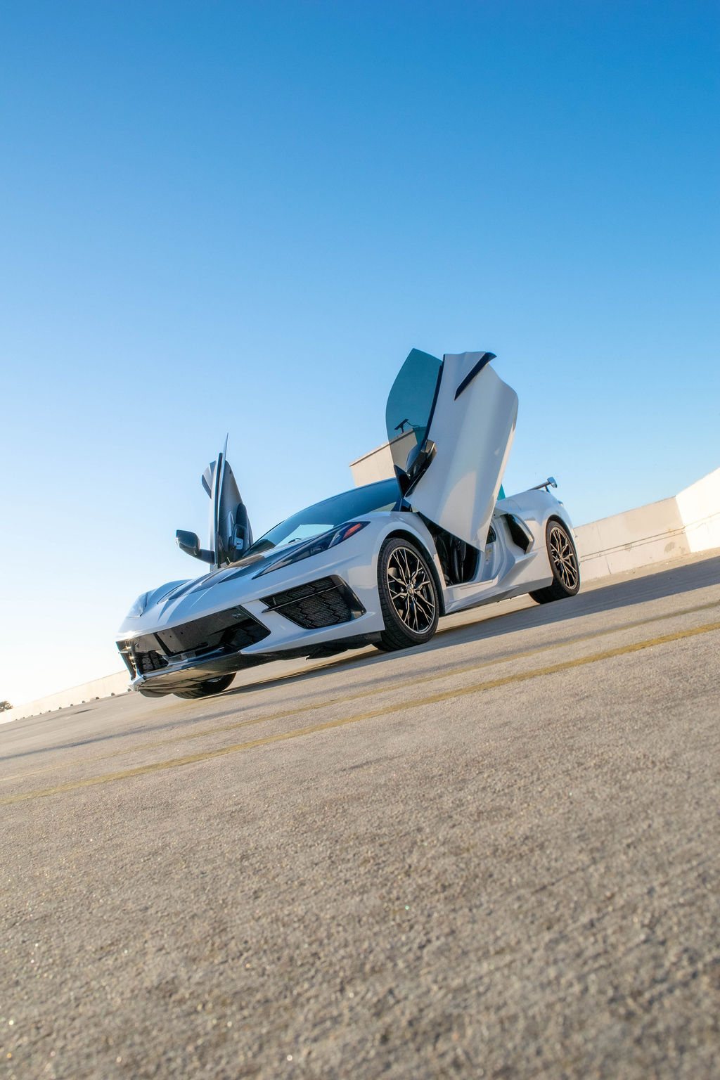 Chevrolet Corvette C8 rental, a 490 hp mid-engine V8 sports car in white