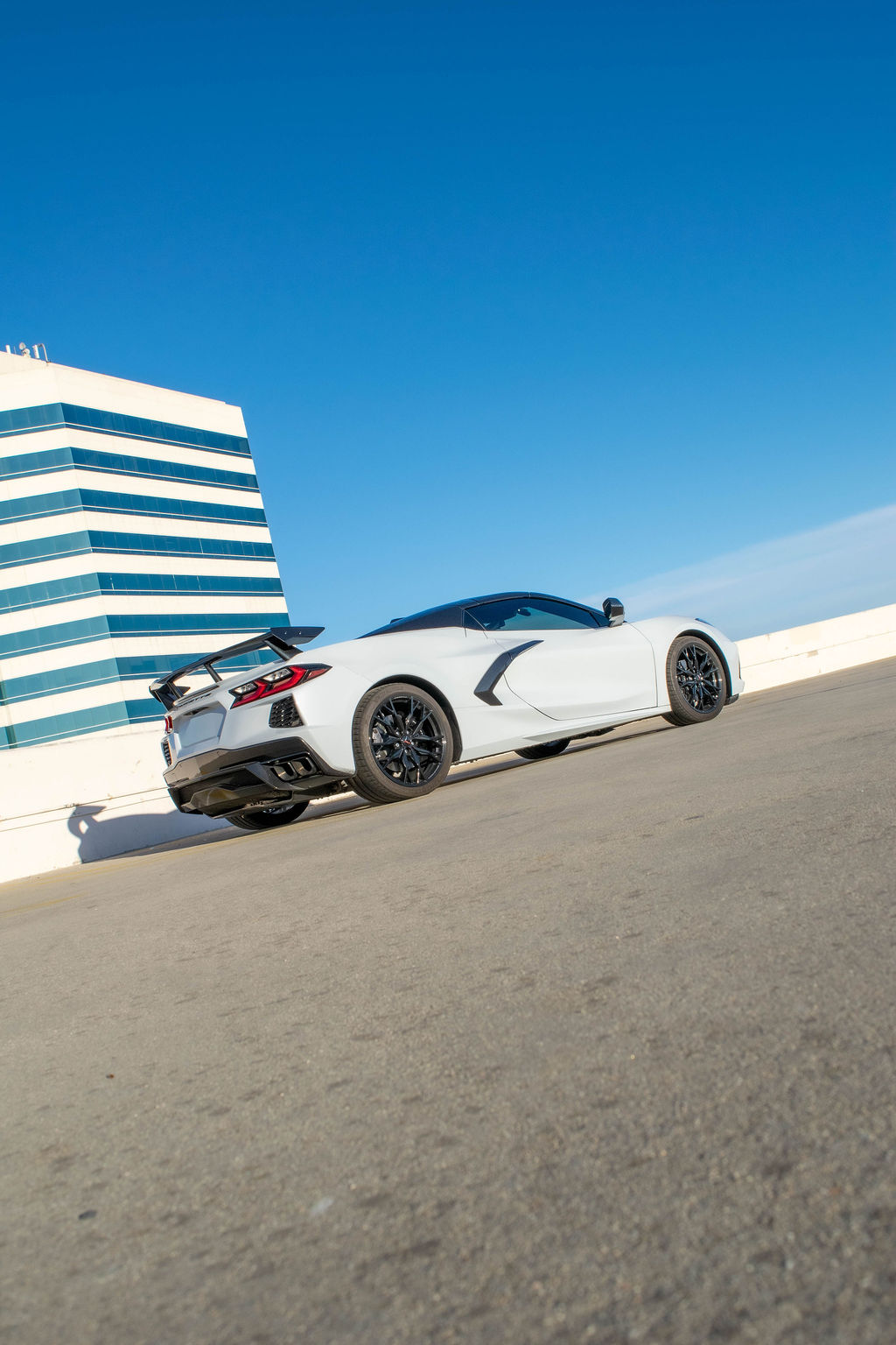 Chevrolet Corvette C8 rental in white, the first Corvette with the engine behind the driver