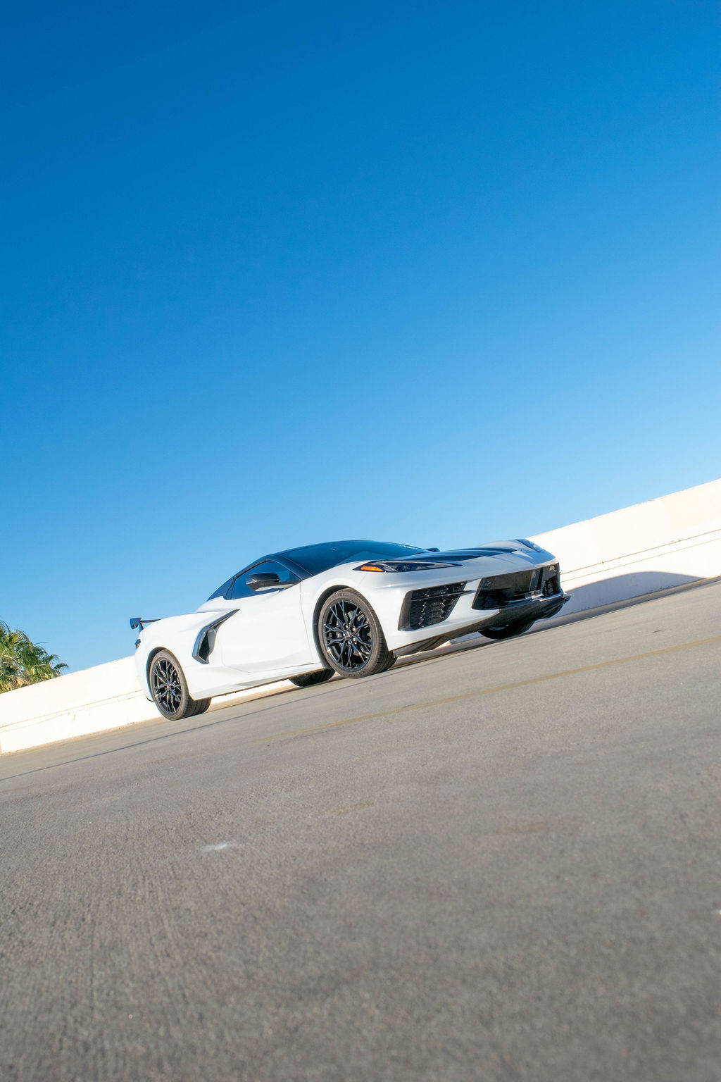 White Chevrolet Corvette C8 rental, reaching 60 mph in 2.9 seconds