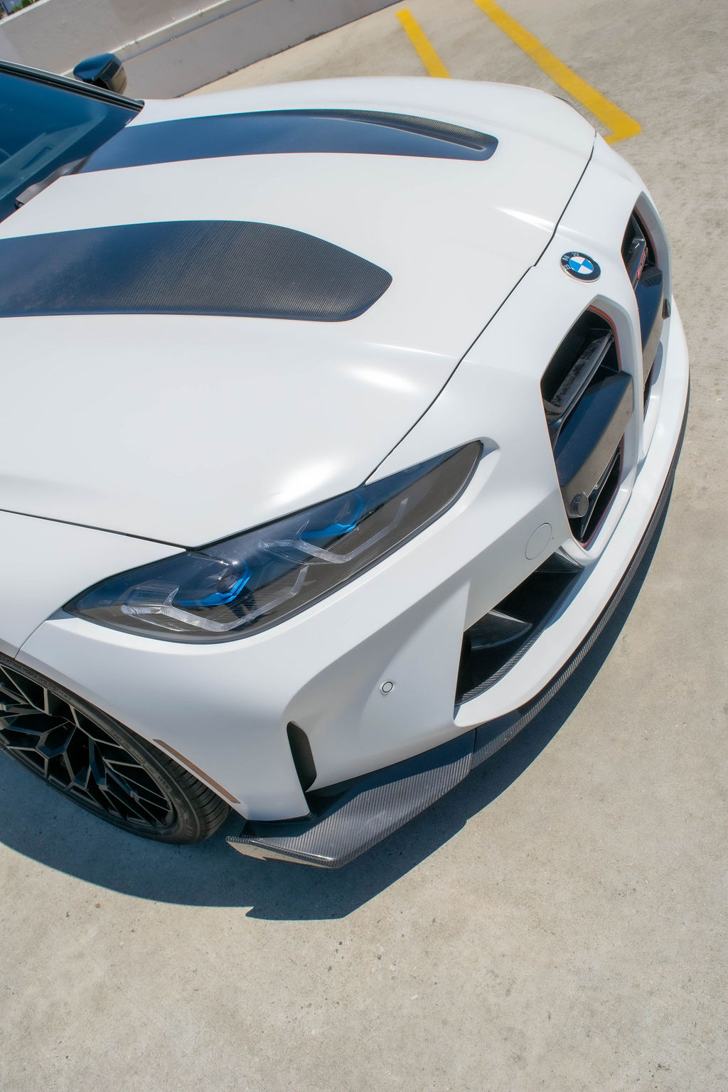 White BMW M3 rental, a sports sedan sharing its engine with the M4