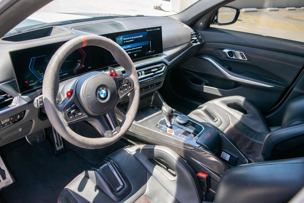BMW M3 rental in white, a 3.0 liter twin-turbo six with an 8 speed automatic