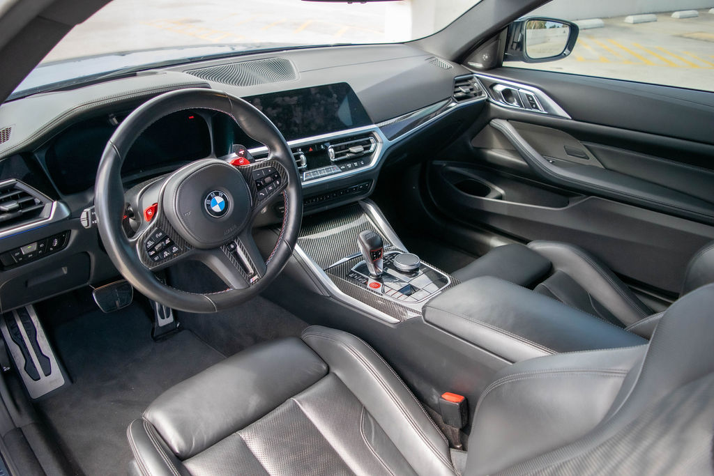 BMW M4 rental in blue, a 3.0 liter twin-turbo six seating 4