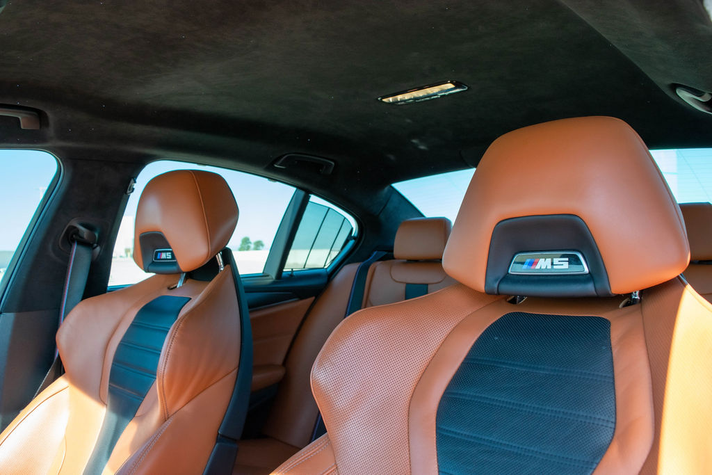 BMW M5 rental, a 4.4 liter V8 sedan with an 8 speed automatic