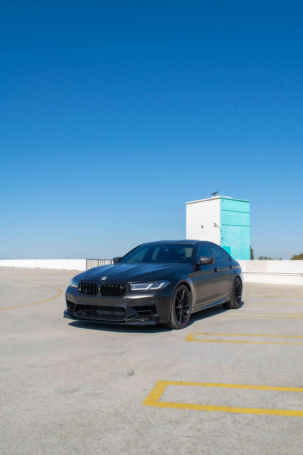 BMW M5 rental in black, a 4 door sedan with a 190 mph top speed