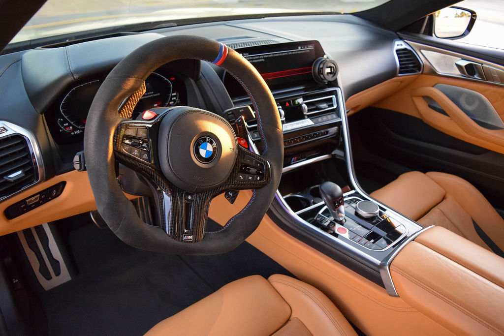 Satin black BMW M8 rental with all-wheel drive