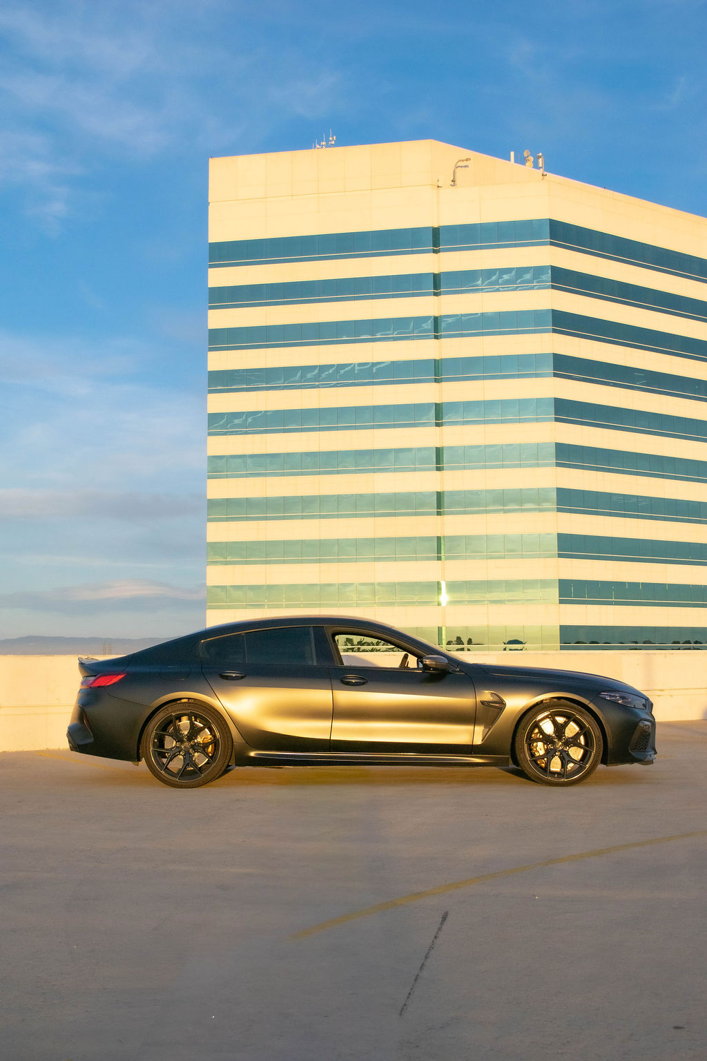 BMW M8 rental in satin black, a V8 grand tourer built for distance