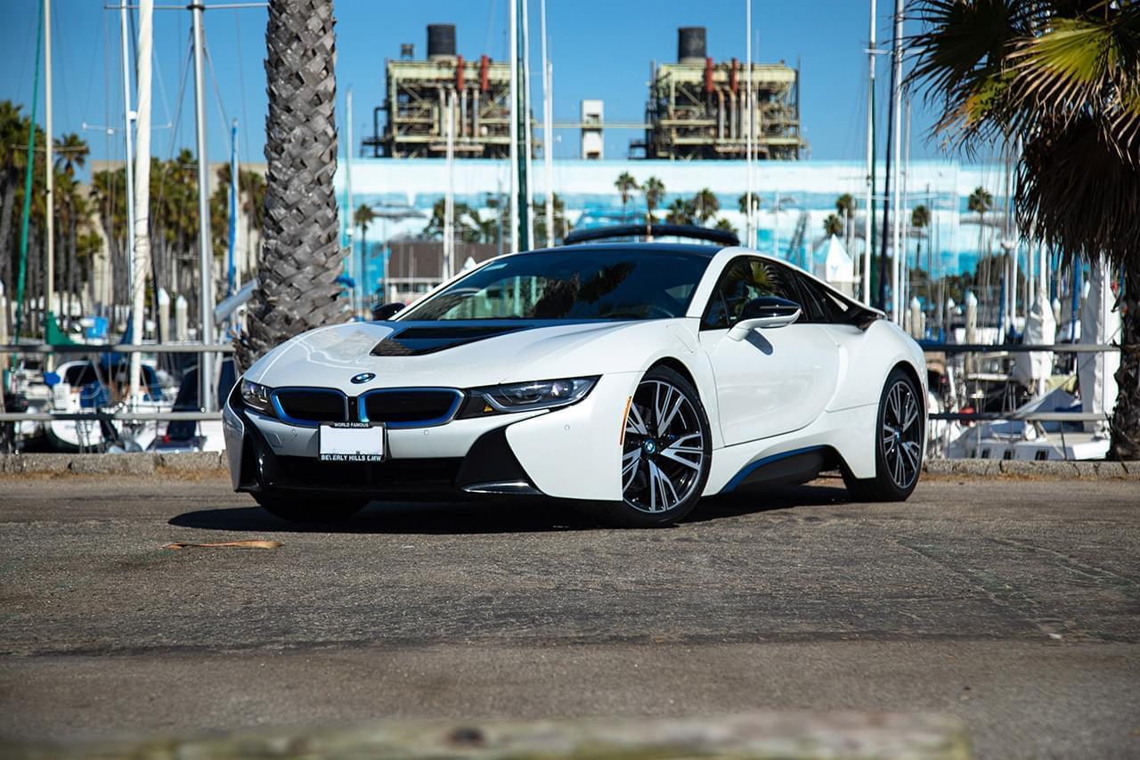 Front view of the BMW i8 rental in white, a 2 door hybrid with butterfly doors