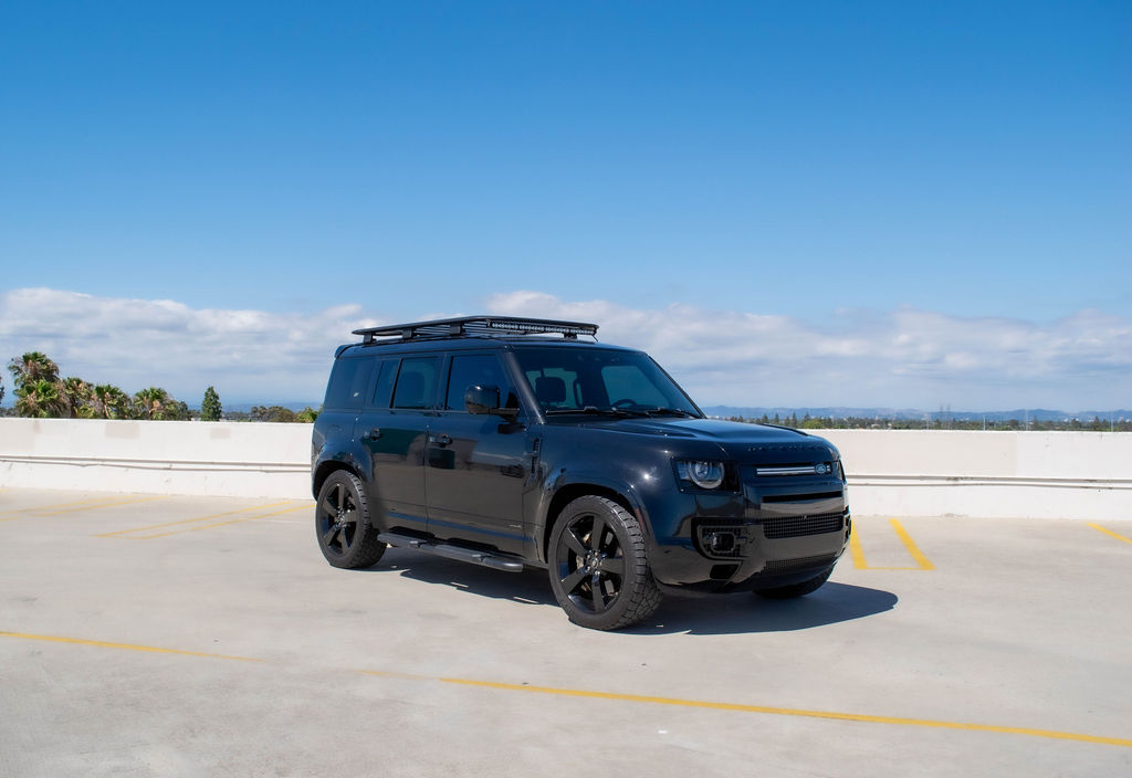Black Land Rover Defender X, a 5 seat off road SUV to rent in Southern California