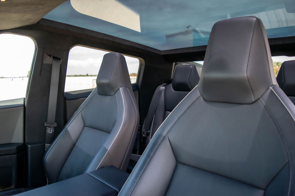 Tesla Cybertruck rental in black, reaching 60 mph in 4.1 seconds
