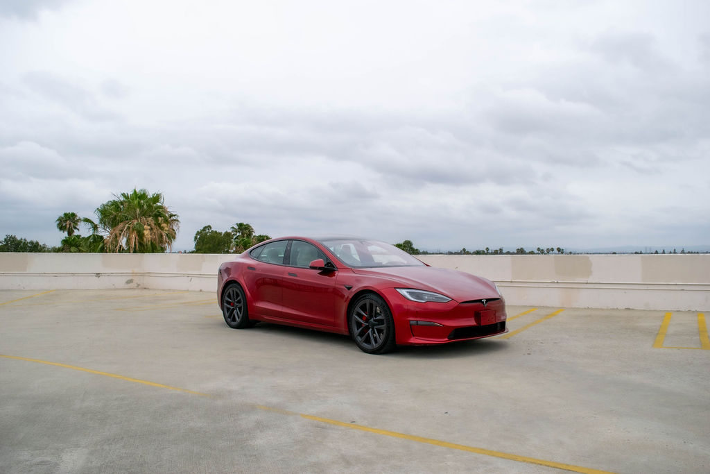 Red Tesla Model S Plaid, a 1,020 hp tri-motor electric sedan to rent in Southern California