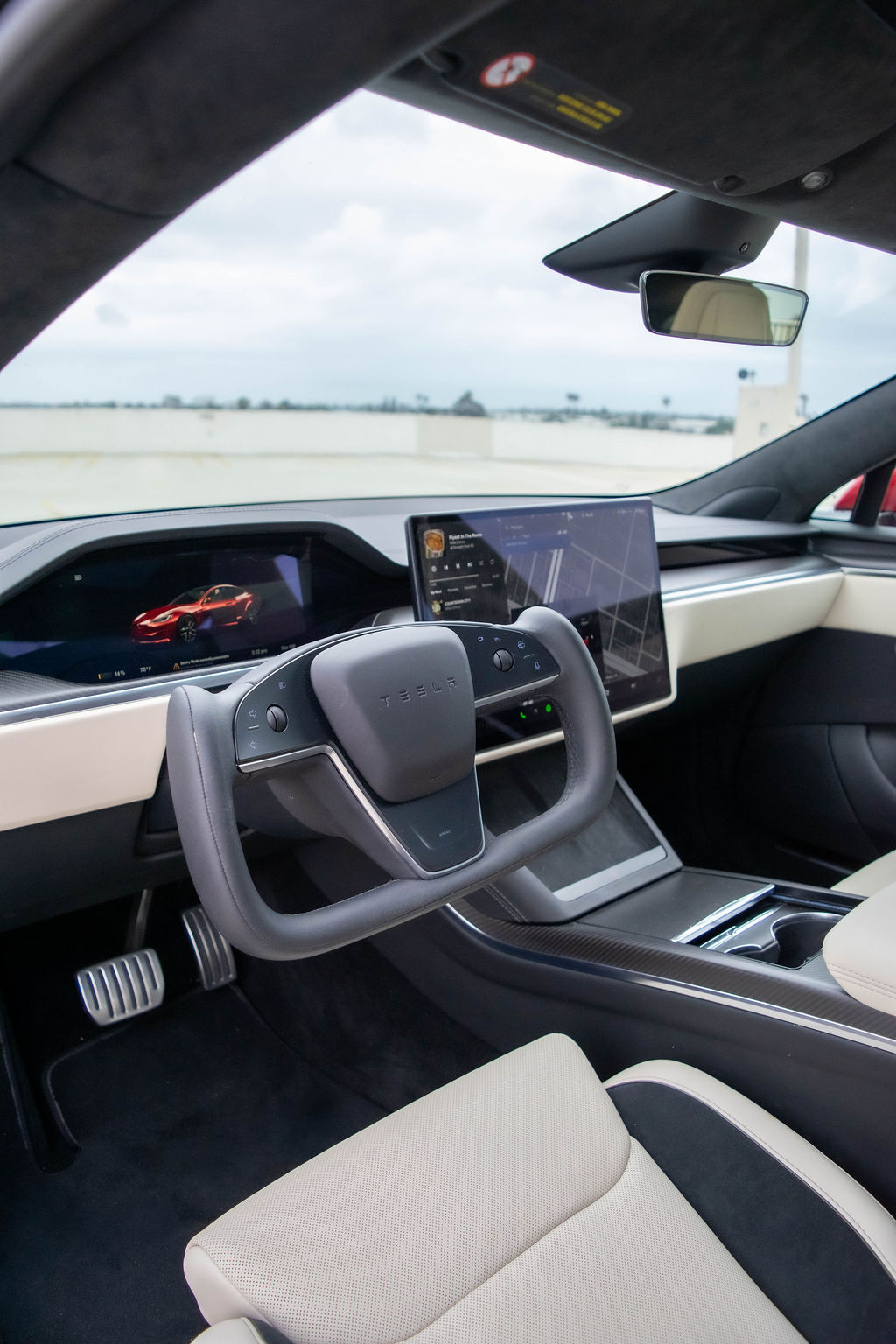 Tesla Model S Plaid rental, a 1,020 hp tri-motor electric sedan in red