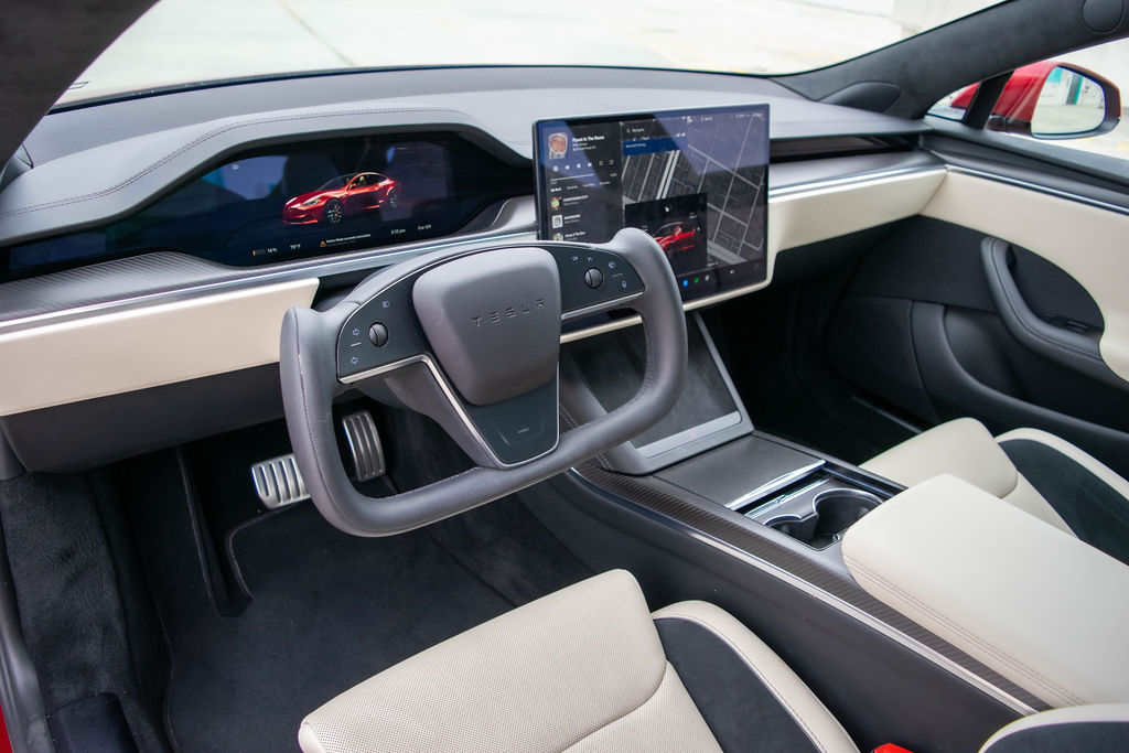 Tesla Model S rental in red, reaching 60 mph in 1.99 seconds