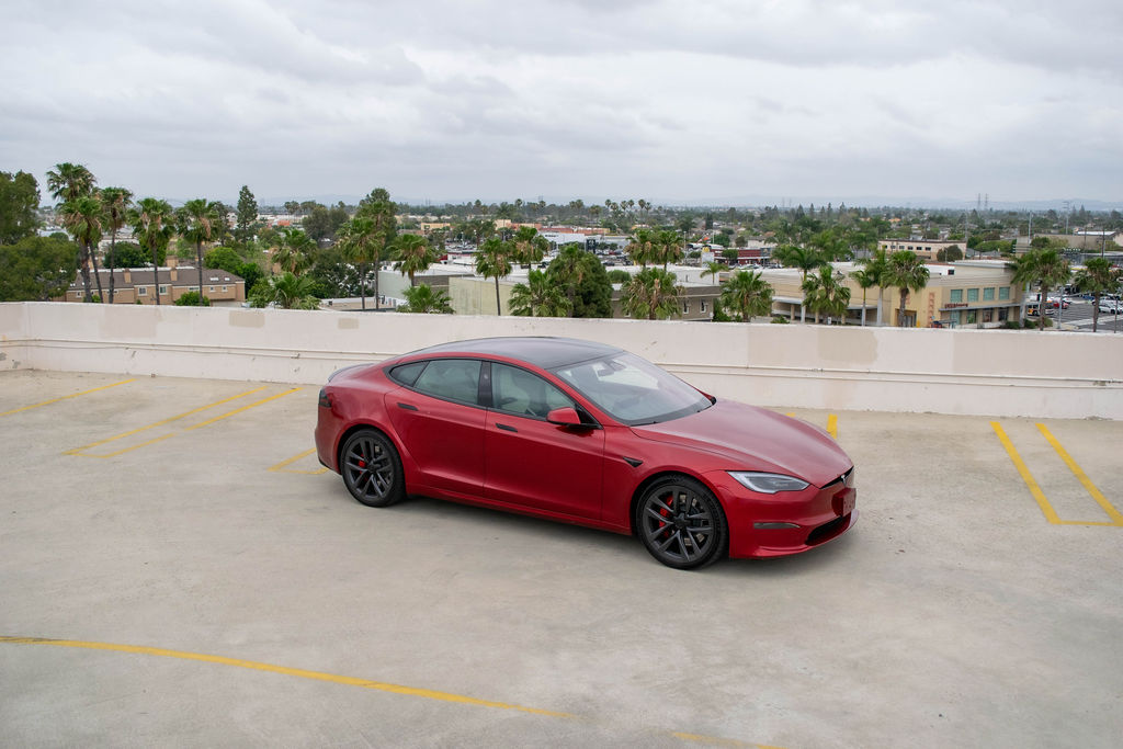 Red Tesla Model S Plaid rental, the top Plaid trim of this 5 seat electric sedan