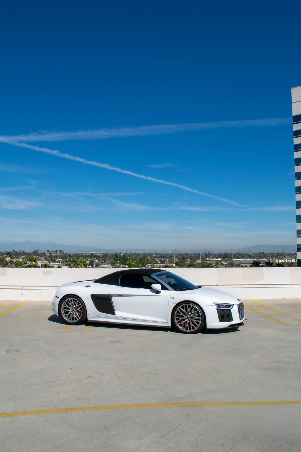 Audi R8 rental, a 5.2 liter naturally aspirated V10 supercar in white