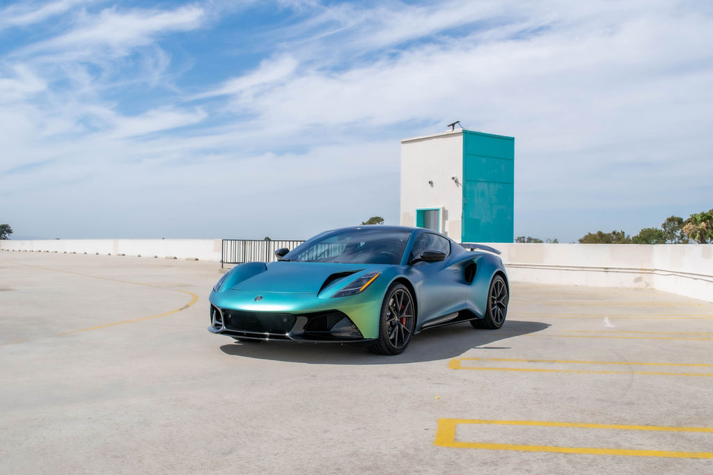 Green Lotus Emira rental, a mid-engined 2 seat sports car