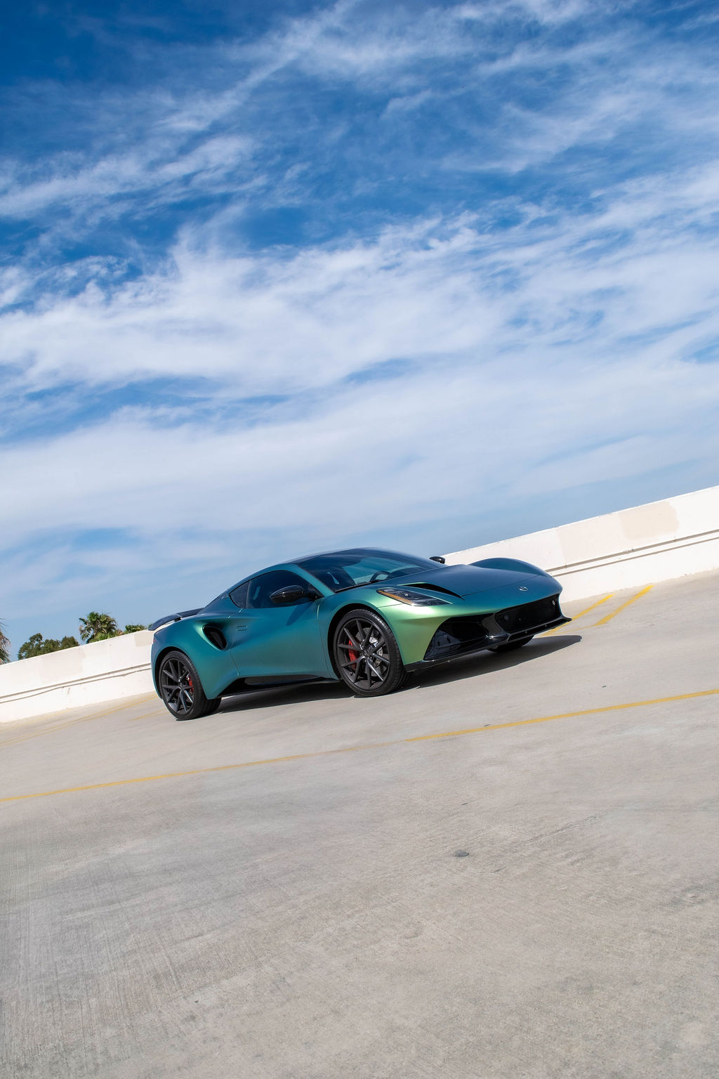 Lotus Emira rental in green, a 3.5 liter supercharged V6 with hydraulic steering
