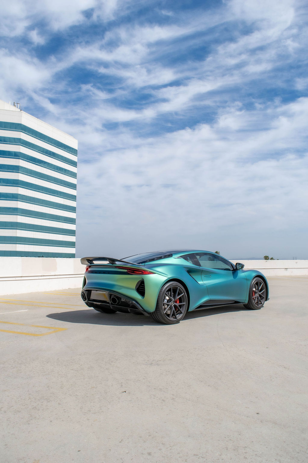 Green Lotus Emira rental, reaching 60 mph in 4.2 seconds