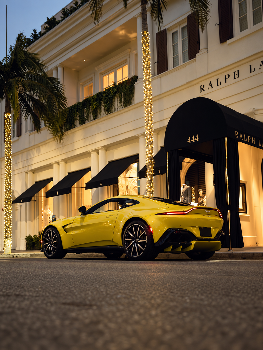 Yellow Aston Martin Vantage rear, rental in Los Angeles